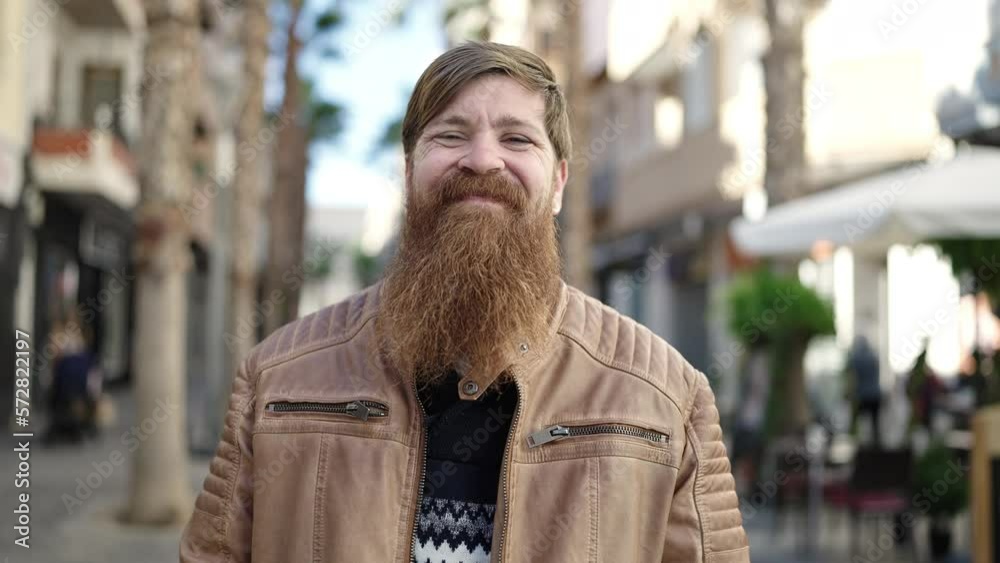 Young redhead man smiling confident standing at coffee shop terrace Young redhead man smiling confident standing at coffee shop terrace