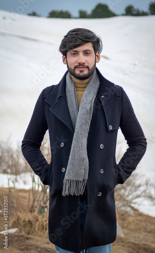 A young man standing at top of mushkpuri hill, Pakistan.