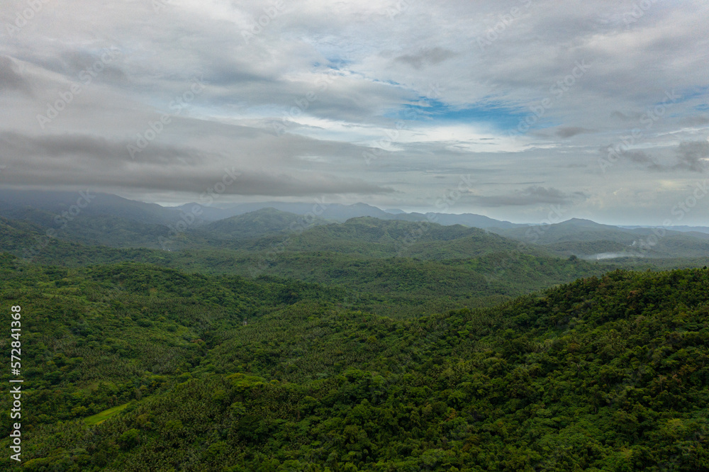 Aerial view of Mountain peaks covered with forest from above. Philippines.