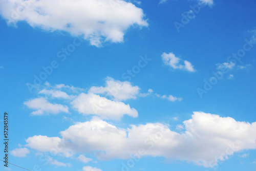 Fantastic view of the azure sky on a sunny day with fluffy clouds. © wattana