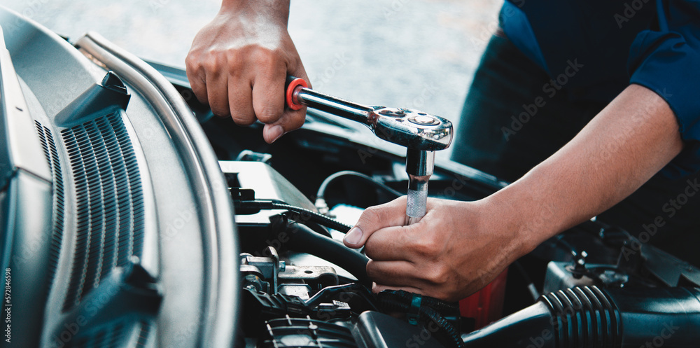 Mechanic open vehicle hood checking up auto mobile, fixing a car at home,Repair and service Mechanic open vehicle hood checking up auto mobile, fixing a car at home,Repair and service