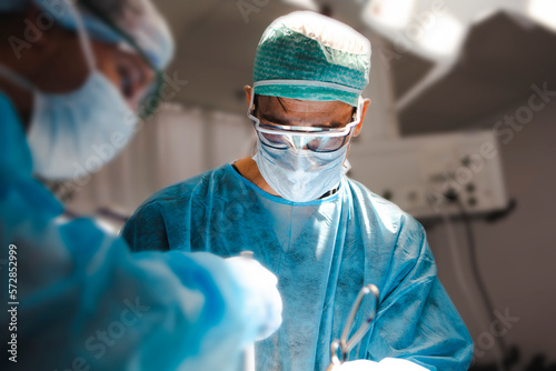 Surgical team treating a neurosurgical brain tumor photo