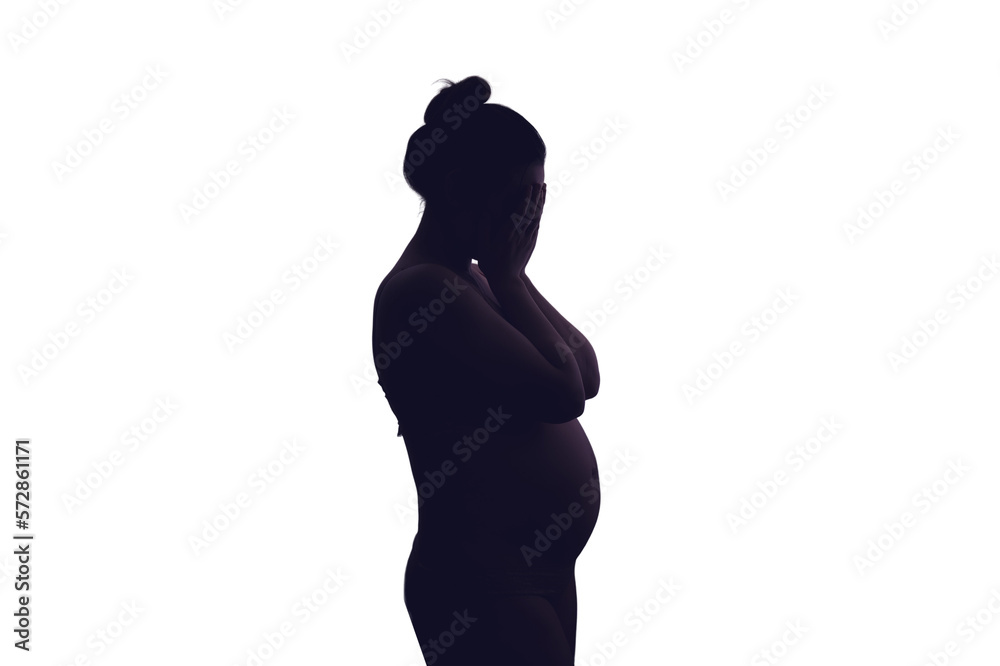 Young pregnant woman crying with her hands folded near her face, isolated on a white background. Pregnancy problems, silhouette of the expectant mother at the night window