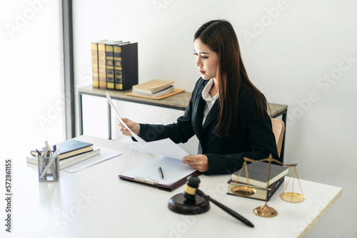 Business lawyer woman holding business contract to reading while