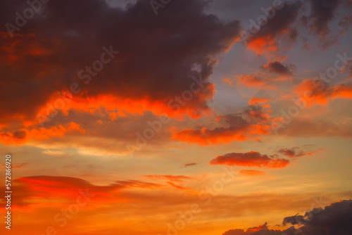 Beautiful colorful dramatic sky with clouds at sunset or sunrise. Abstract sky background