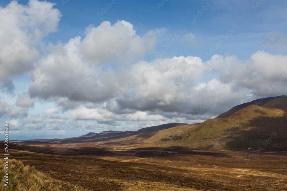 Large clouds over vast hilly grassland, Scotland, UK Large clouds over vast hilly grassland, Scotland, UK