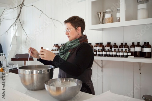 Woman working in perfume store