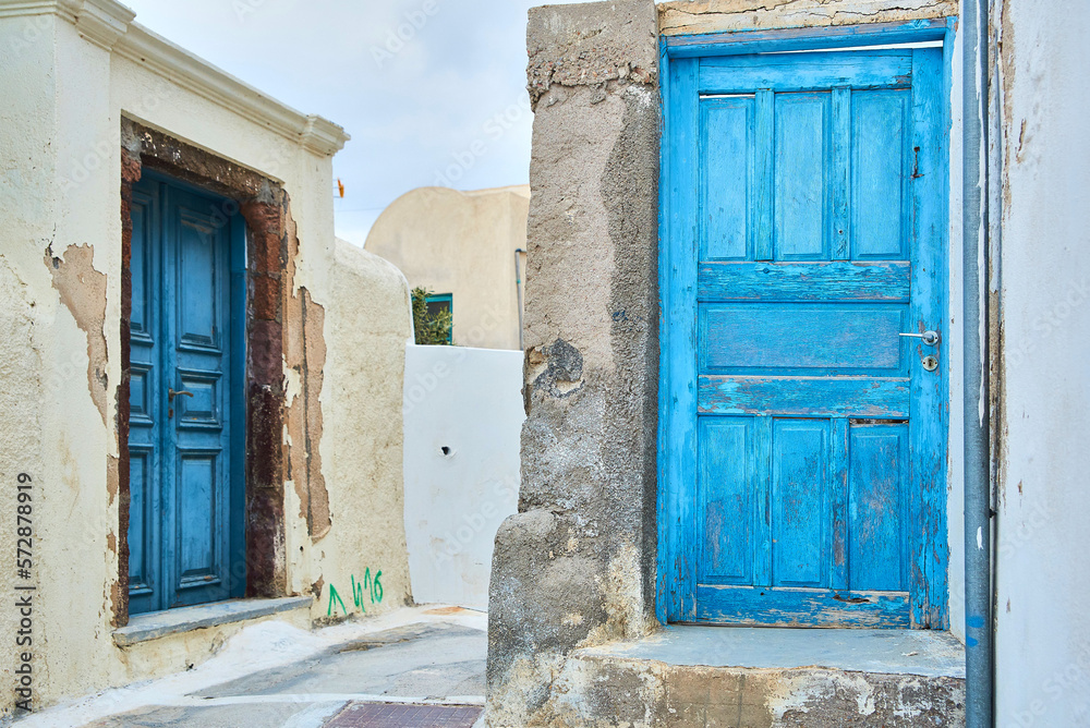 Light Blue old front door to a house in a vintage minimalist Greek village