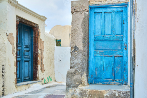 Light Blue old front door to a house in a vintage minimalist Greek village