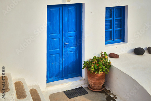Dark Blue front door to a house in an old minimalist Greek village 
