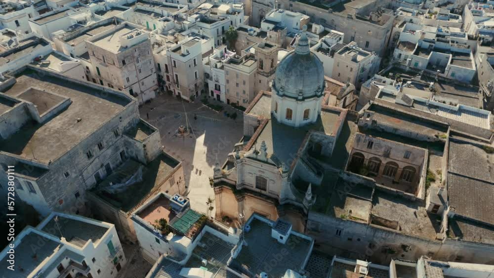 Fast drone panning shot of the historical church Santa Teresa in the Italian city Monopoli on a sunny day. Fast drone panning shot of the historical church Santa Teresa in the Italian city Monopoli on a sunny day.