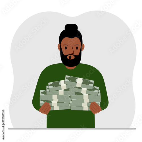 A man is holding a large pile of paper money.