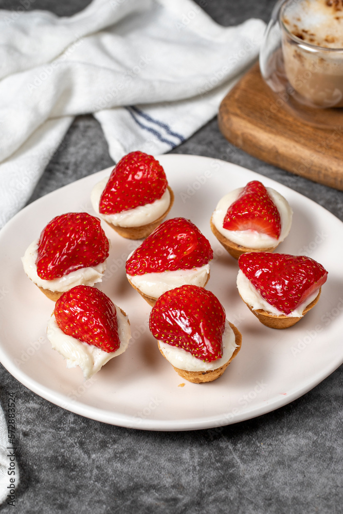 Strawberry tartlet. Delicious tartlet dessert on plate. close up Strawberry tartlet. Delicious tartlet dessert on plate. close up