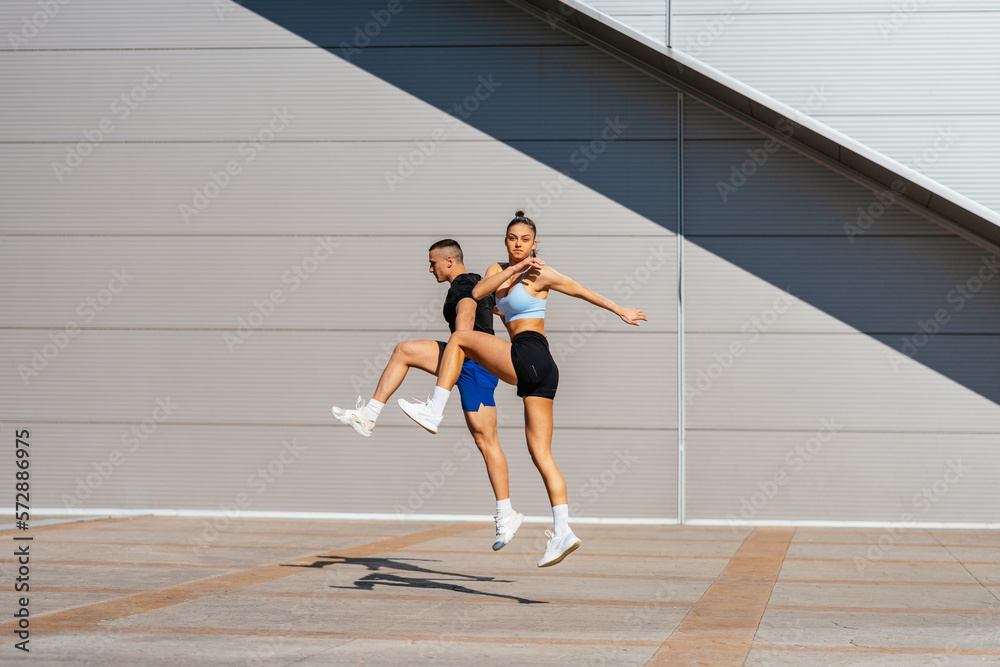 Fit couple exercising together Fit couple exercising together