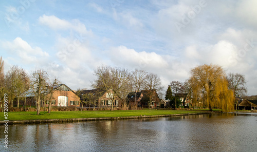 View of the river Oude Rijn near Woerden in the province of Utrecht with beautiful reflection of the clouds in the water