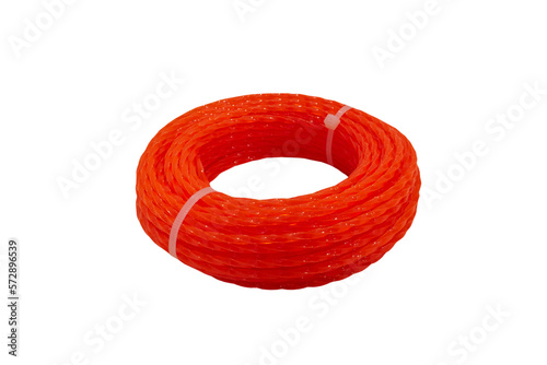 A spool of orange trimmer line for a grass,fishing line isolated on a white background, orange kapron fishing line for mowing grass