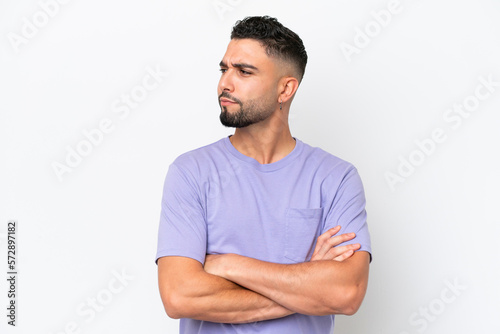 Young Arab handsome man isolated on white background looking to the side