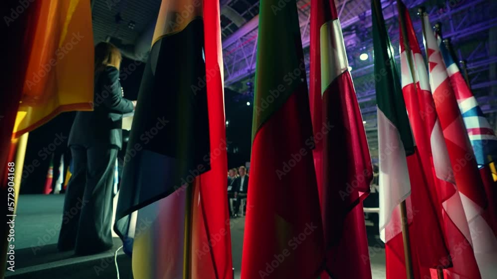 Many flags of different countries. Official conference with representatives of different countries of the world. Diplomatic meeting. Presentation or political meeting.