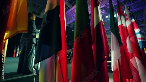Many flags of different countries. Official conference with representatives of different countries of the world. Diplomatic meeting. Presentation or political meeting.