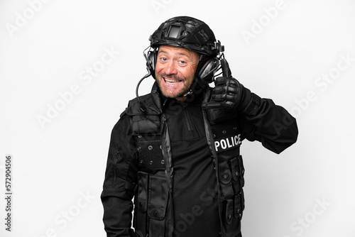 Middle age SWAT man isolated on white background making phone gesture. Call me back sign