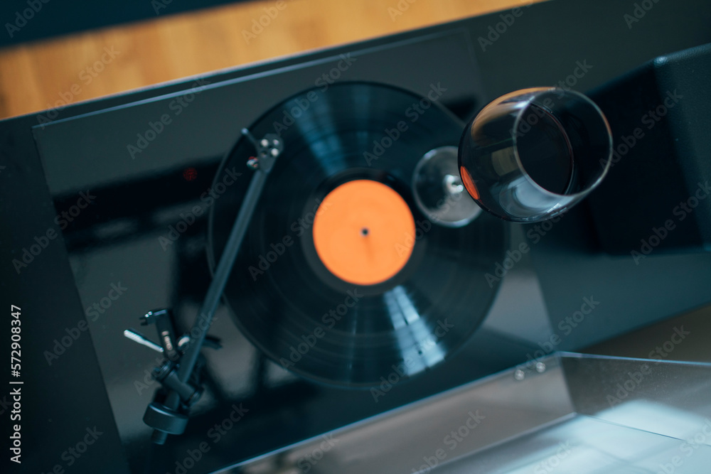 High angle view of glass of wine swirling on the turntable High angle view of glass of wine swirling on the turntable