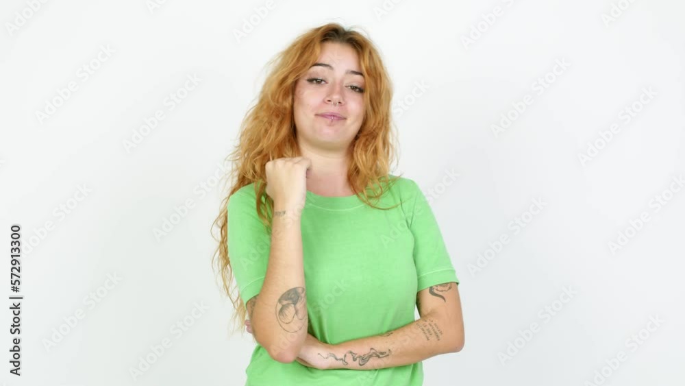 Young redhead woman looking front over isolated background