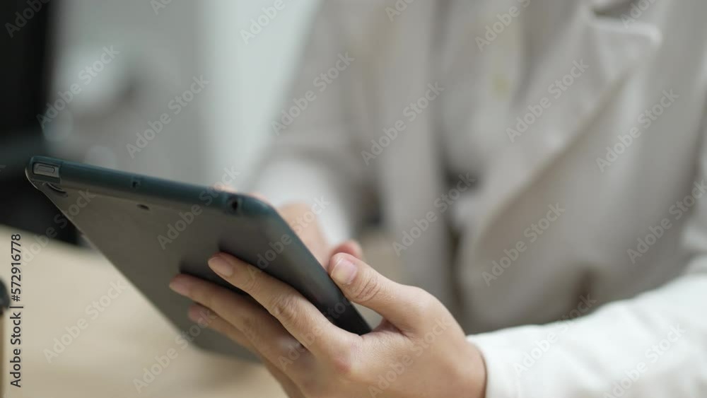 Businesswoman Using Digital Tablet to Sending Email in Office Businesswoman Using Digital Tablet to Sending Email in Office