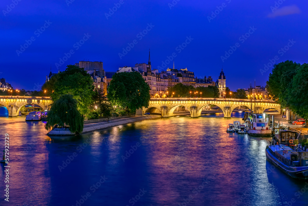 Pont Neuf is the oldest bridge across the river Seine and  island Cite in Paris, France. It is one of the symbols of Paris. Night cityscape of Paris
