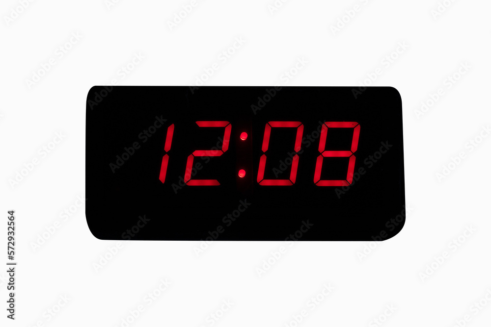 Digital alarm clock time LED red number on black digital electric isolated on white background. time symbol concept for celebrating the New Year. Digital alarm clock time LED red number on black digital electric isolated on white background. time symbol concept for celebrating the New Year.