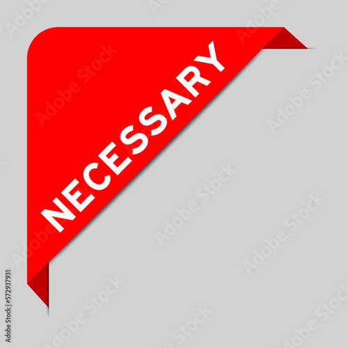 Red color of corner label banner with word necessary on gray background