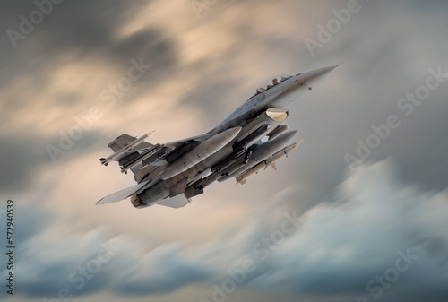 F-16 fighter jet armed with missiles and bombs wanted by Ukraine Government. F16 Falcon flying fast and low on a military combat mission. Nato jet fighter bomber. 