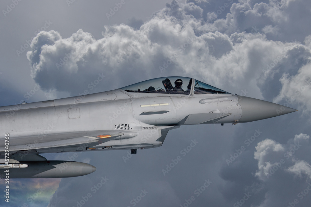 RAF Typhoon Fighter Jet in Flight. Action photograph of Fast Jet military aeroplane on a combat mission. Used against Houthi Rebels