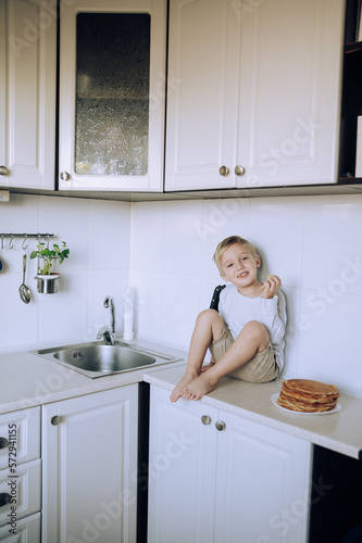 child in kitchen little boy in the kitchen. bright scandinavian cuisine