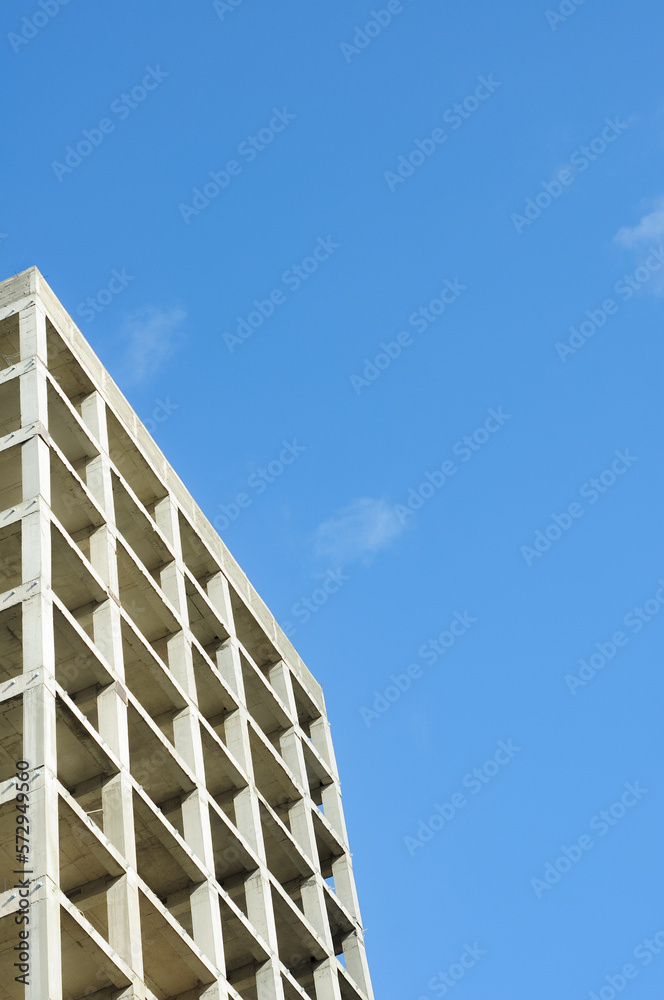 Modern unfinished multistory building. Higher building view. Modern unfinished multistory building. Higher building view.