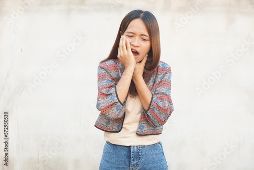 Asian woman having a toothache