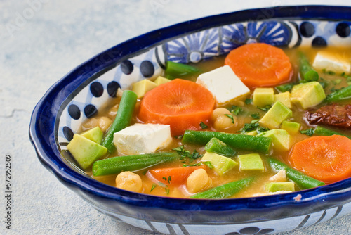 伝統的なメキシコのスープ　カルド・トラルペーニョ　チレ・チポトレを添えて　コピースペースあり　Traditional Mexican soup Caldo Tlalpeño with chipotle  copy space available photo