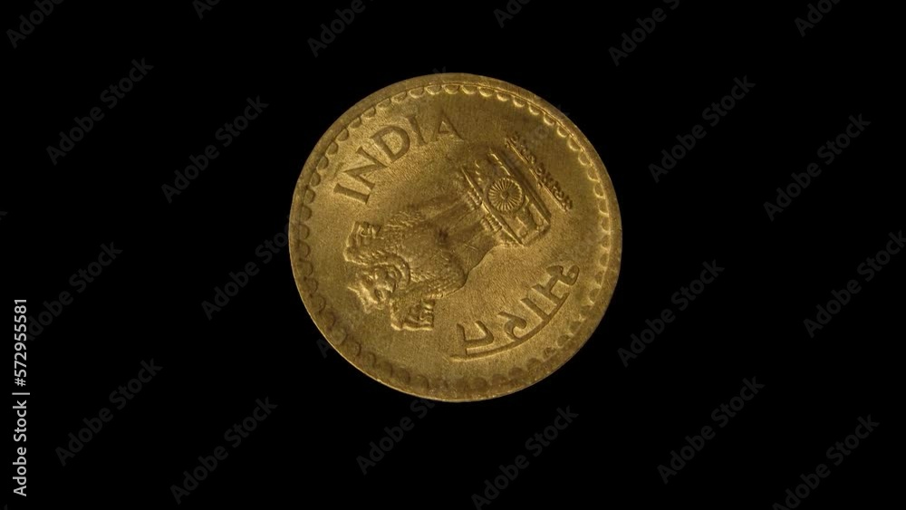 Rotating reverse of India coin 5 rupees 2009 with inscription meaning INDIA, isolated in black background. 4k video. Rotating reverse of India coin 5 rupees 2009 with inscription meaning INDIA, isolated in black background. 4k video.