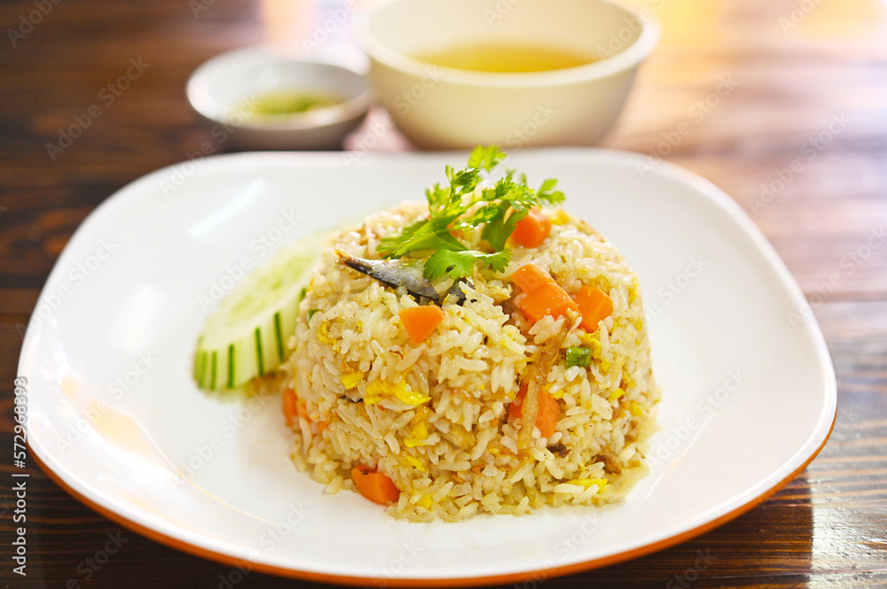 mackerel Fried Rice fish.Quick and Easy Thai style spicy one dish meal and soup on white plate mackerel Fried Rice fish.Quick and Easy Thai style spicy one dish meal and soup on white plate