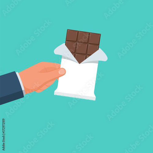 Chocolate holding in hand. Chocolate bar. Vector illustration flat design. Isolated on white background.