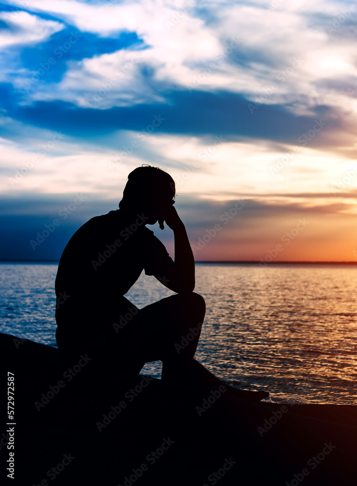 Sad Man Silhouette at Sunset Stock Photo | Adobe Stock