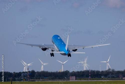 Passenger plane taking off from the runway, Schiphol, Amsterdam, The Netherlands photo