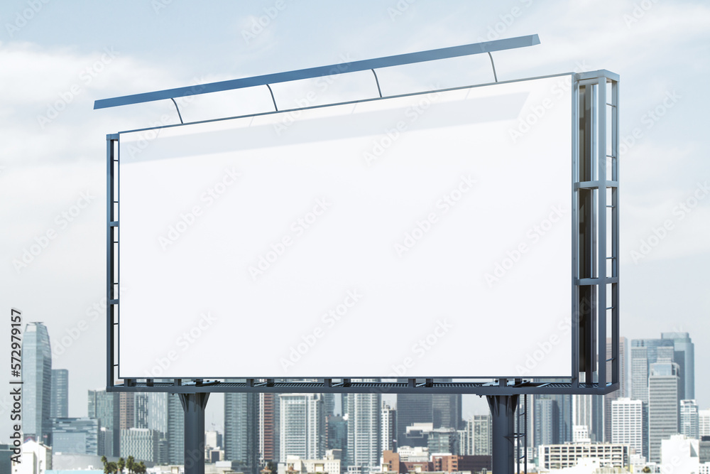 Blank white billboard on cityscape background at daytime, perspective view. Mock up, advertising concept Blank white billboard on cityscape background at daytime, perspective view. Mock up, advertising concept