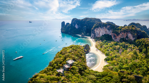 Aerial view of the beautiful Hong island in Thailand with lush greenhills and golden beaches surrounded by emerald sea