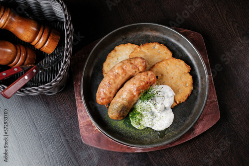 Fried sausages with potato pancakes