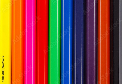 Colored pencils facets, lie side by side, close-up full depth of field