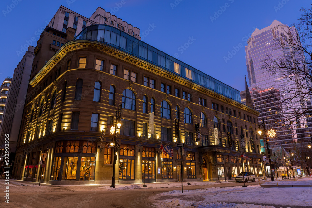 Naklejka premium Phillips Square, in downtown Montreal, has been decorated with beautiful illuminated decorations for the winter, which enhances the beauty of the Birks Hotel