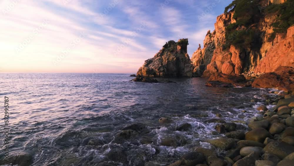 Sunrise on the coastline of the sea (Cala S'Agulla, Costa Brava - Spain) Sunrise on the coastline of the sea (Cala S'Agulla, Costa Brava - Spain)