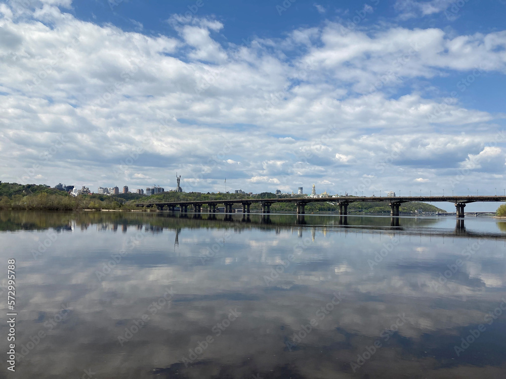 Kiev city bridge over the Dnieper river. Scenic view of the city landscape. The famous bridge. Residential buildings. view to the big river Kiev city bridge over the Dnieper river. Scenic view of the city landscape. The famous bridge. Residential buildings. view to the big river