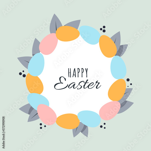 Easter wreath with multi-colored eggs and leaves and the inscription Happy Easter