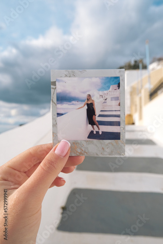 Photo of a woman in Oia, Santorini, Greece.